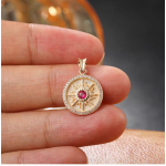 Collector's Eye of the Sun pendant: 18K gold garnet